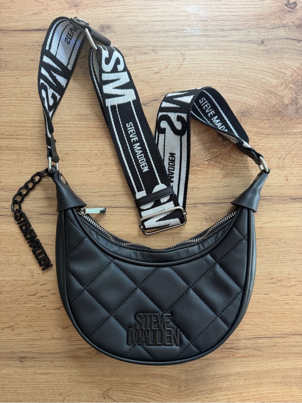 Steve Madden Black Quilted Crescent Crossbody with Logo Strap